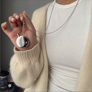Silver Color pocket perfume bottle On Brown Cord necklace